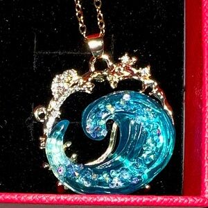 Gold-Tone Blue Ocean Wave Pendant Necklace with Crystal Accents